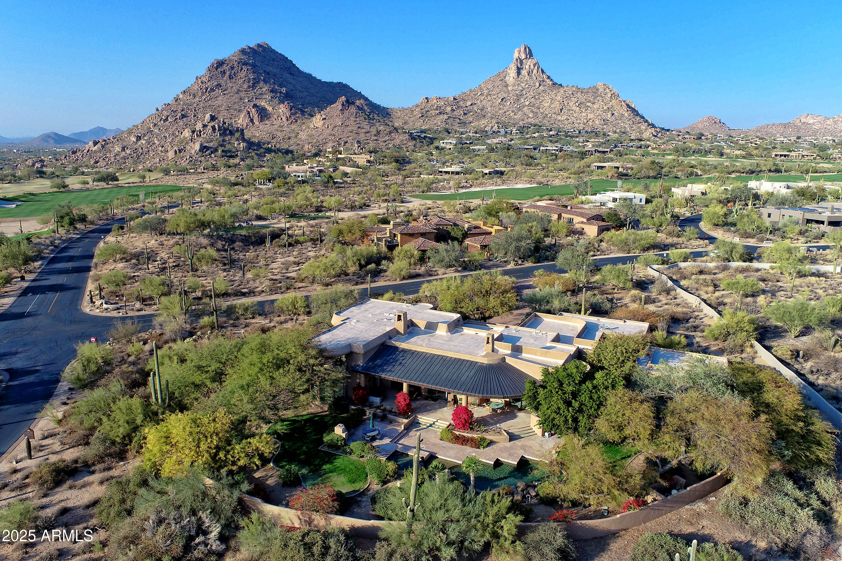 10040 East Happy Valley Road, Unit 595 Scottsdale, AZ 85255 - Photo 3 of 48 an aerial view of a house with a mountain