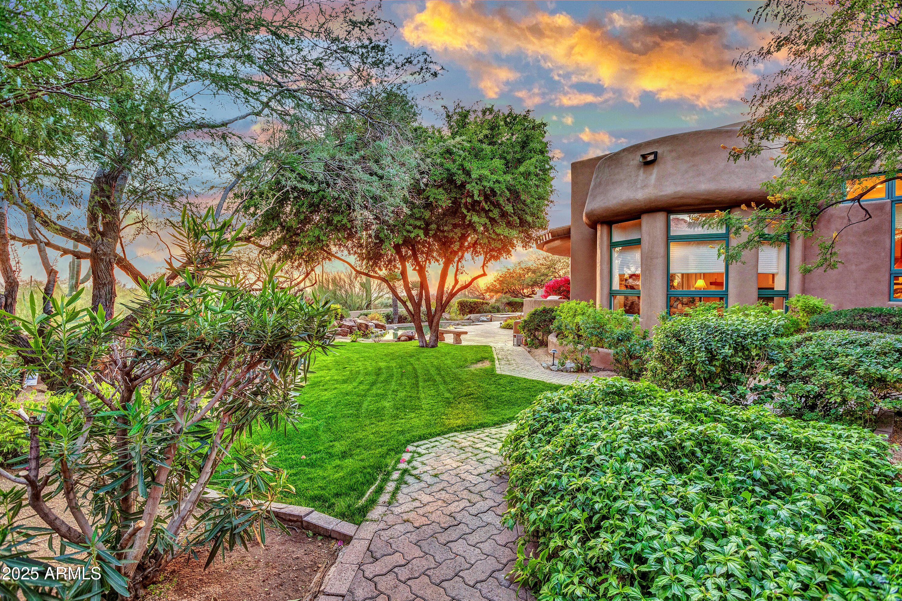 10040 East Happy Valley Road, Unit 595 Scottsdale, AZ 85255 - Photo 38 of 48 a view of a big yard with plants and large trees