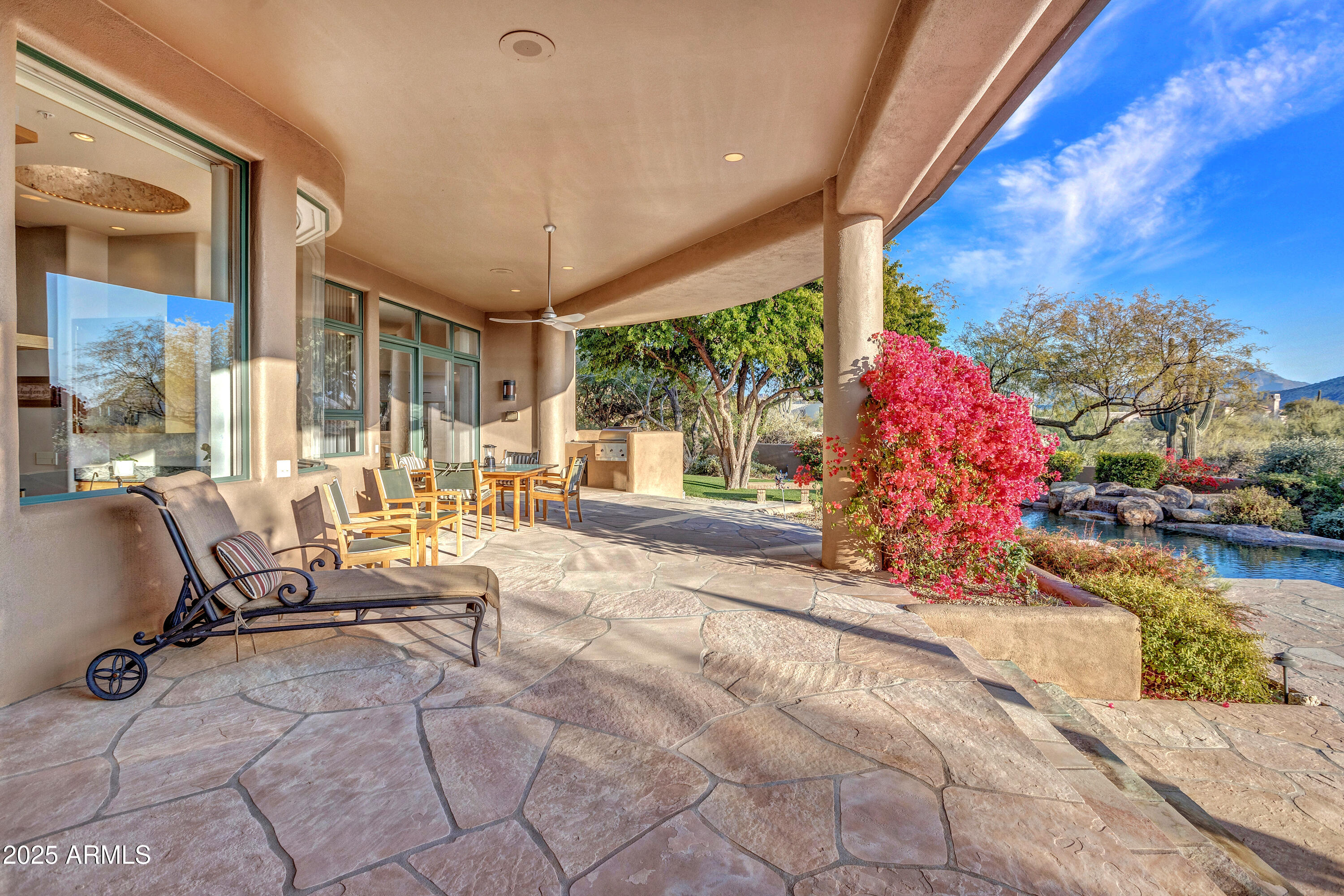 10040 East Happy Valley Road, Unit 595 Scottsdale, AZ 85255 - Photo 45 of 48 a building outdoor space with patio furniture and potted plants