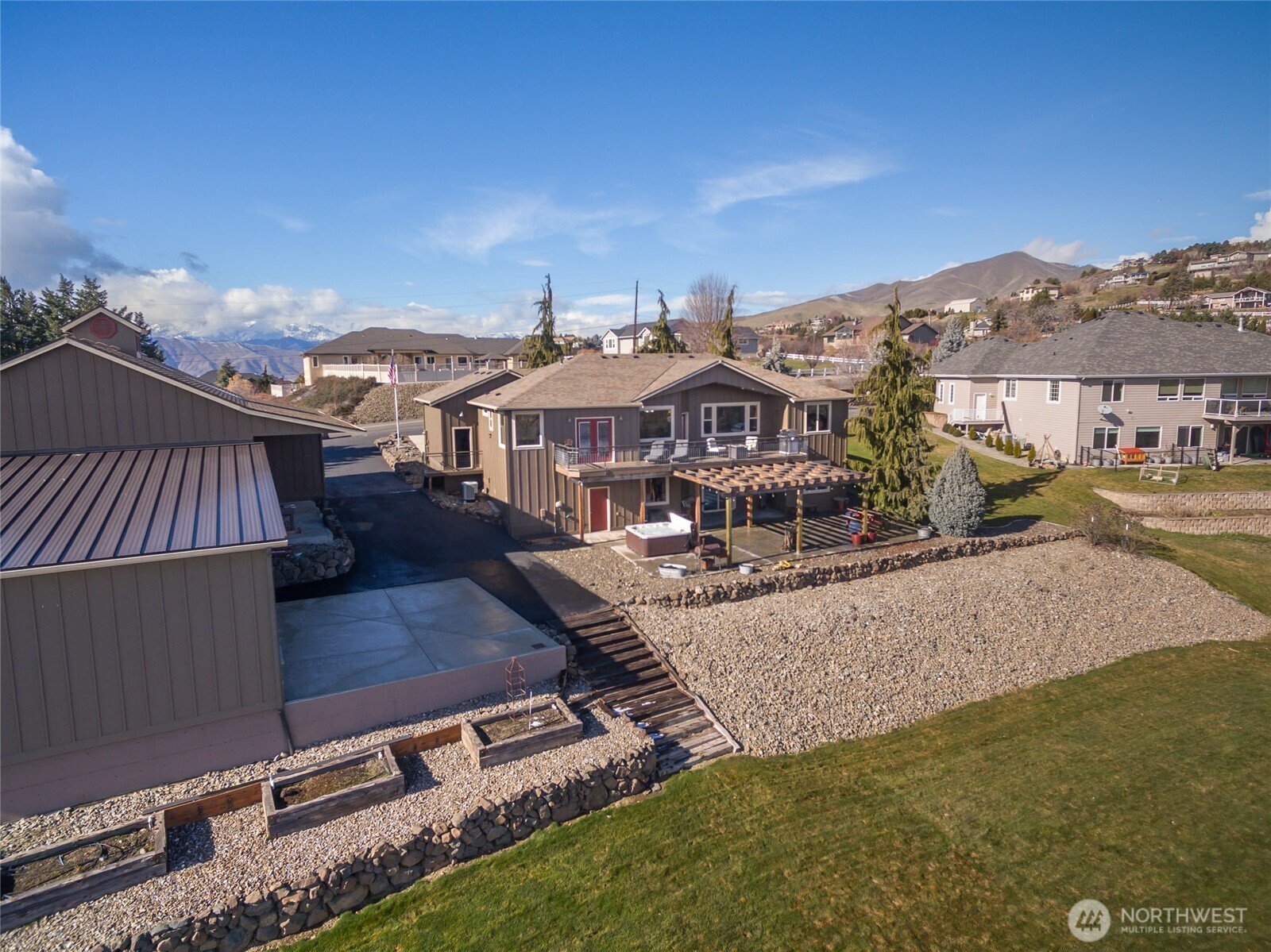 3765 Lovell Road Wenatchee, WA 98801 - Photo 36 of 40 a view of a big house with a big yard and large trees