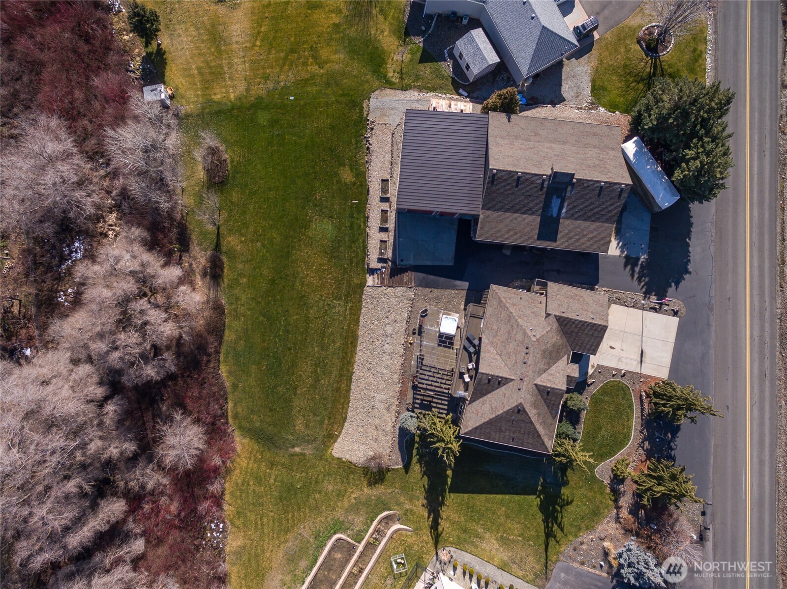 3765 Lovell Road Wenatchee, WA 98801 - Photo 39 of 40 an aerial view of a house with swimming pool and large trees