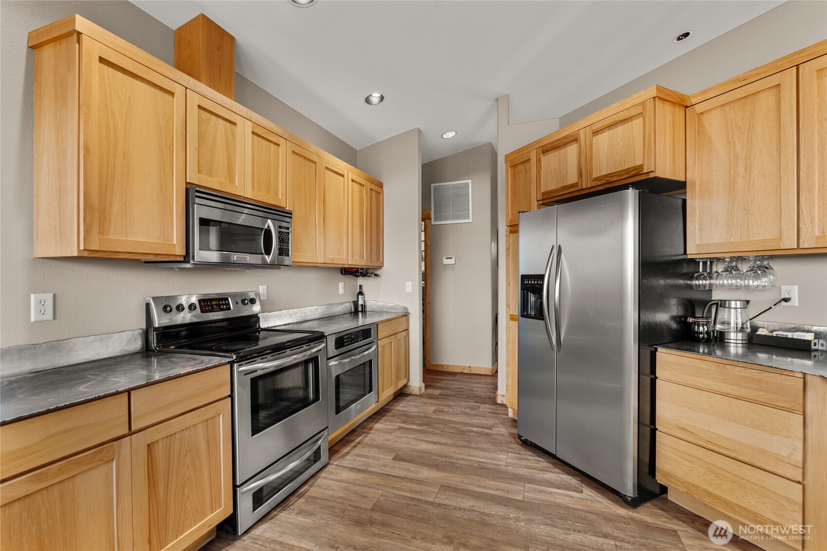 3765 Lovell Road Wenatchee, WA 98801 - Photo 10 of 40 a kitchen with stainless steel appliances granite countertop a refrigerator microwave and sink