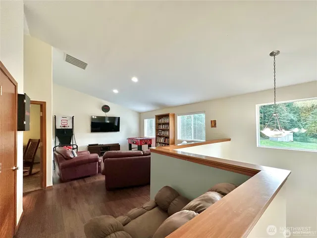 a living room with furniture window and a flat screen tv