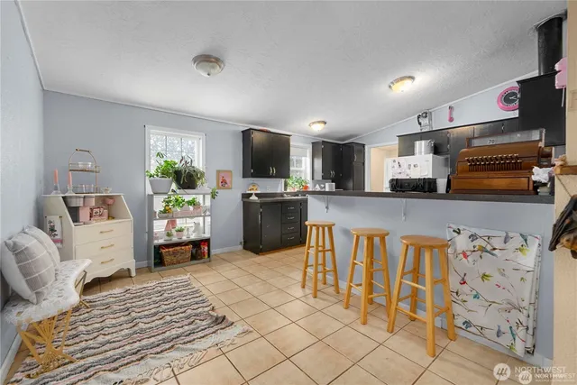 a kitchen with stainless steel appliances microwave stove refrigerator and sink