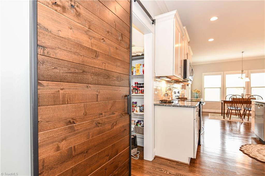 7434 Princess Ann Court Rural Hall, NC 27045 - Photo 14 of 30 Spacious pantry that is concealed by barn door.