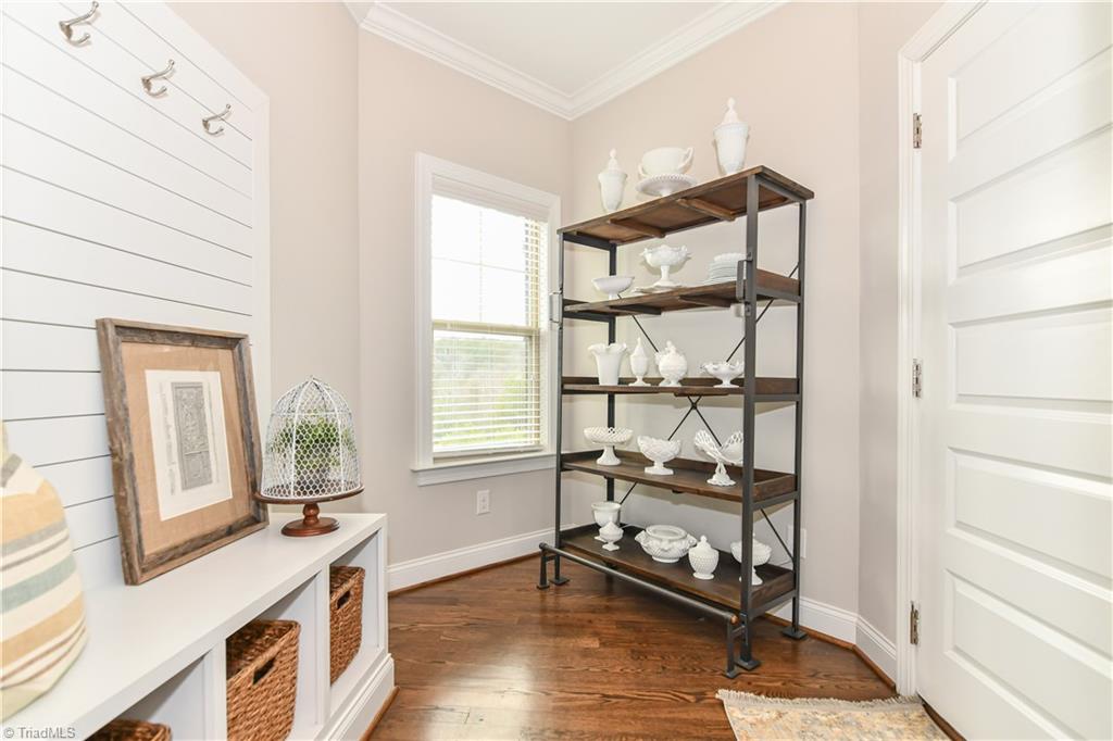 7434 Princess Ann Court Rural Hall, NC 27045 - Photo 21 of 30 Mud room is just past garage entrance and is perfect for storage or displays. Featuring shiplap coat rack, and hardwoods.