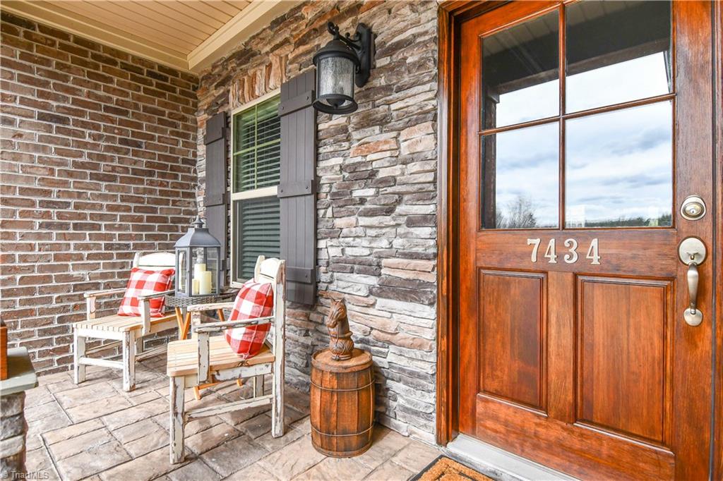 7434 Princess Ann Court Rural Hall, NC 27045 - Photo 5 of 30 Entry with stone front and wooden front door.