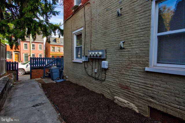 a view of a pathway with a house in the background