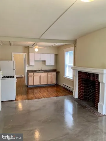 a view of kitchen with granite countertop oven and a sink