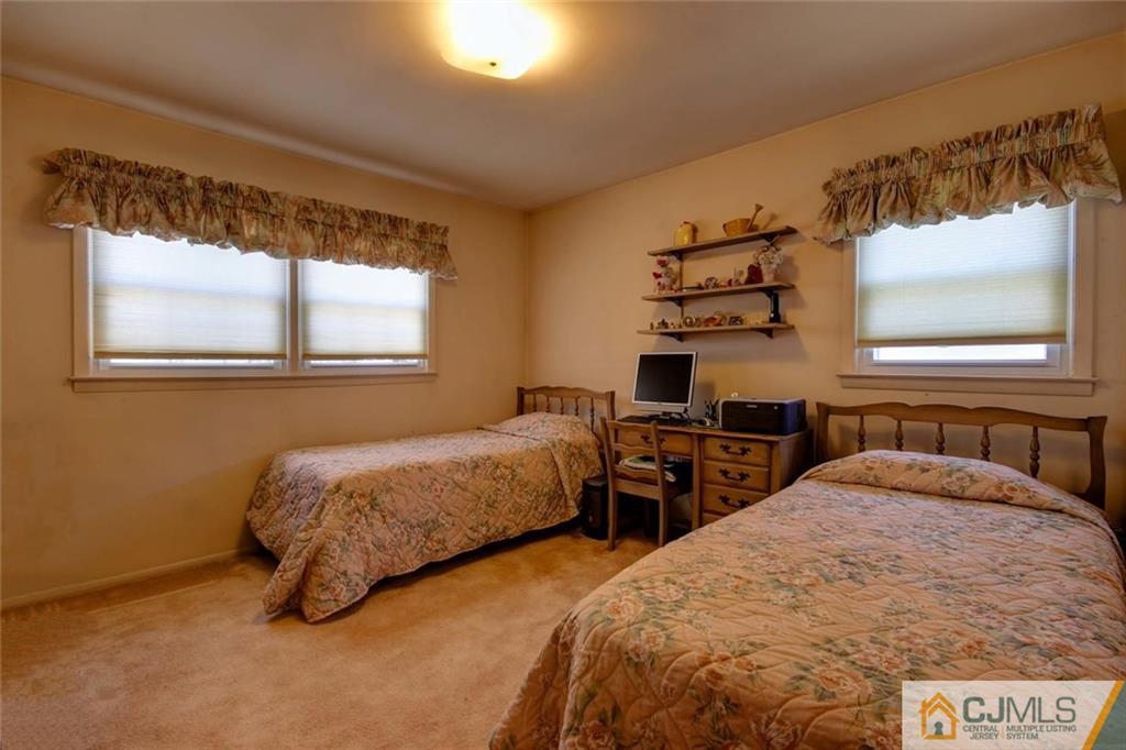 32 Bodnarik Road Edison, NJ 08837 - Photo 14 of 24 a bedroom with two beds and a window