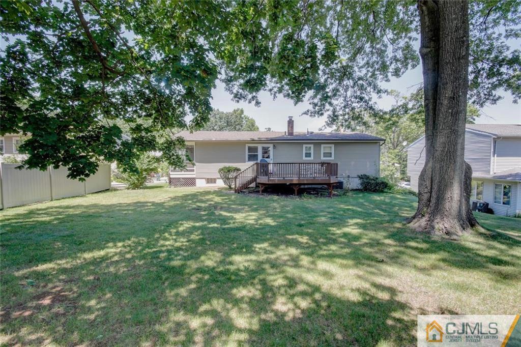 32 Bodnarik Road Edison, NJ 08837 - Photo 22 of 24 a view of a house with a backyard and a tree