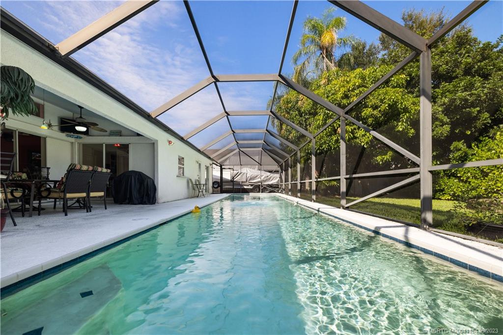 5279 Southeast Horseshoe Point Road Stuart, FL 34997 - Photo 21 of 34 a view of a backyard with a swimming pool