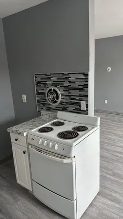 a view of a closet with wooden floor