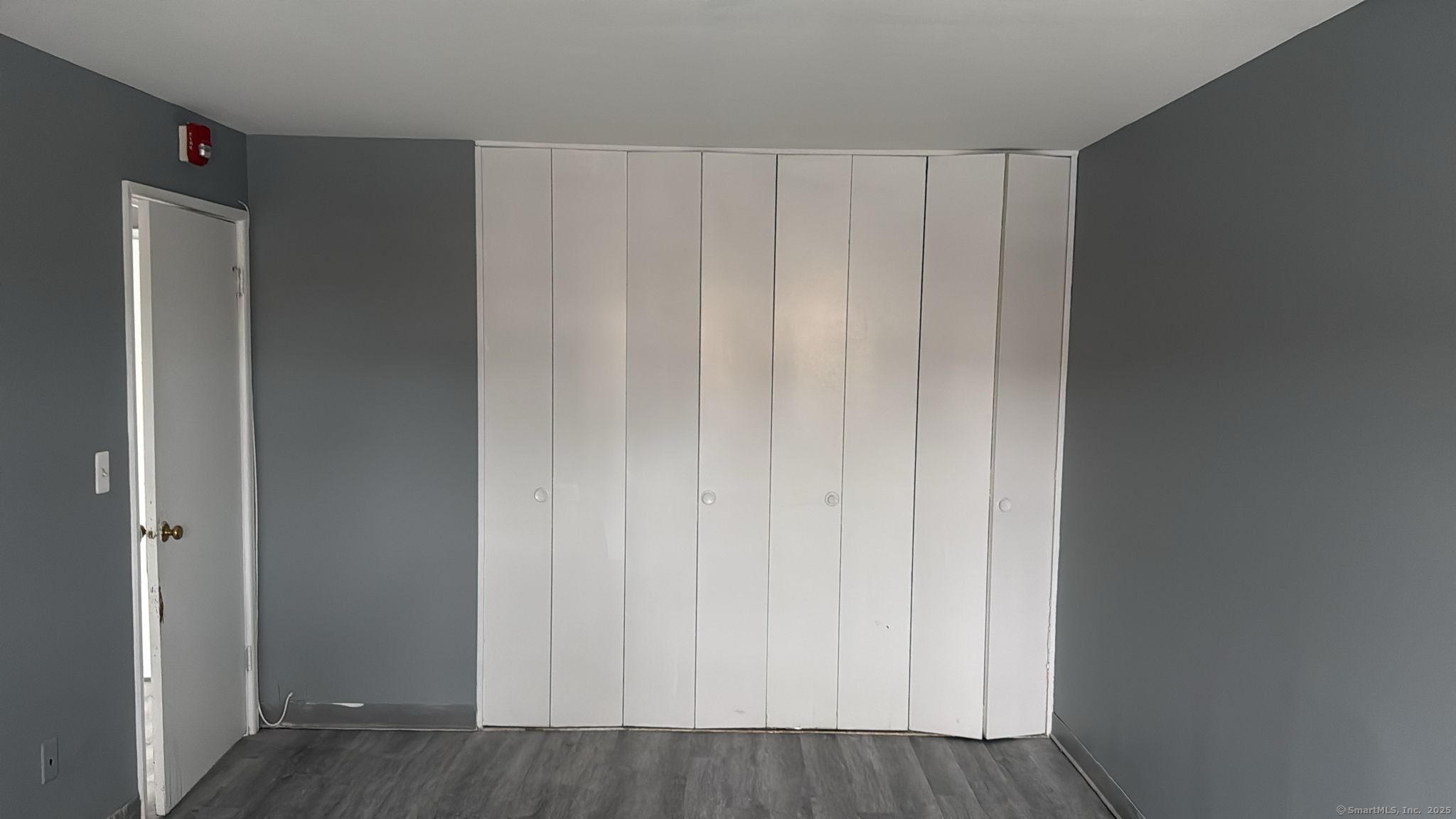 191 Oak Street, Unit B6 Bridgeport, CT 06604 - Photo 12 of 15 a view of a closet with wooden floor