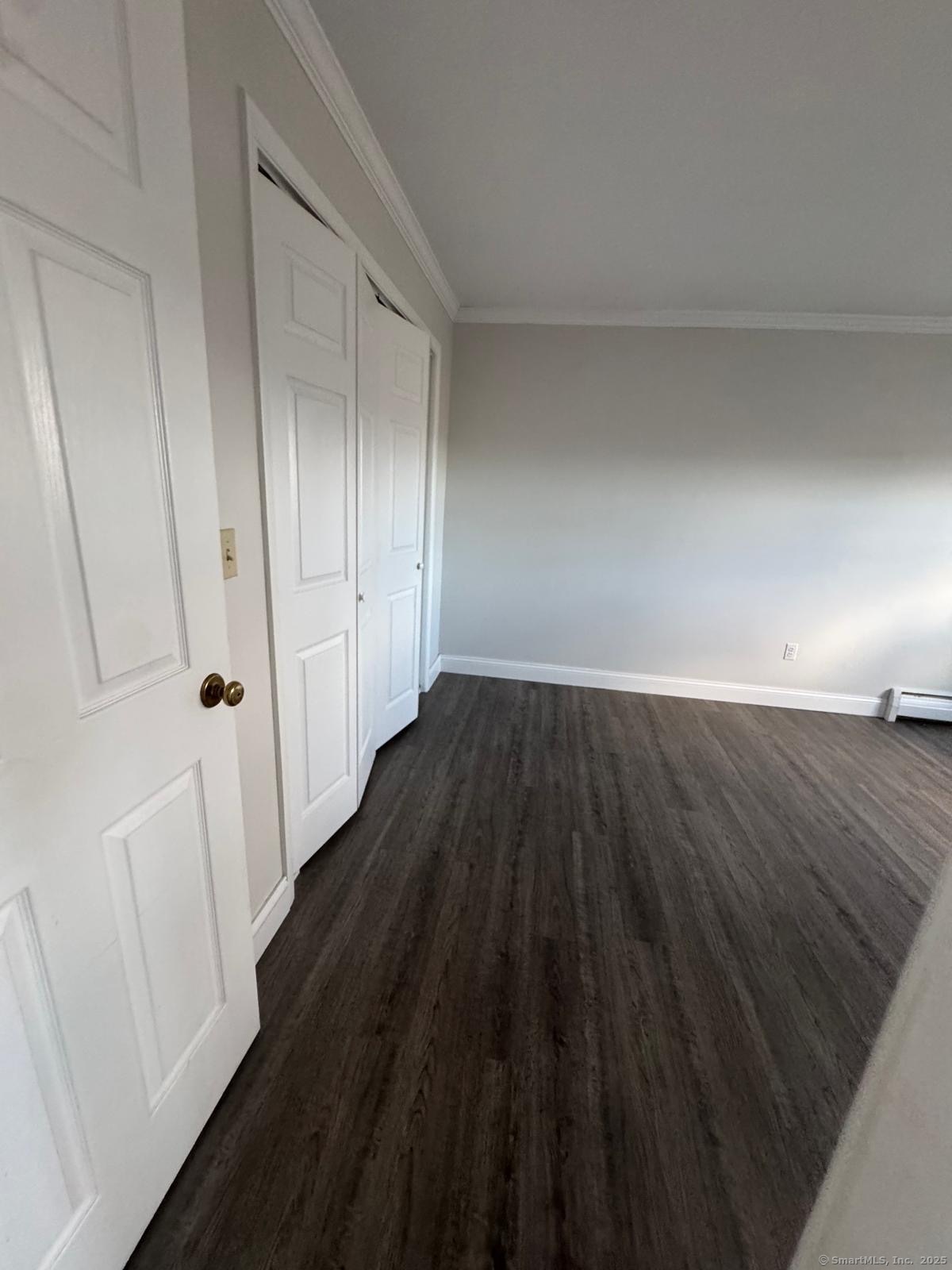 191 Oak Street, Unit B6 Bridgeport, CT 06604 - Photo 2 of 15 a view of a hallway with wooden floor