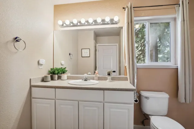 a bedroom with a baby bed baby crib and a dresser