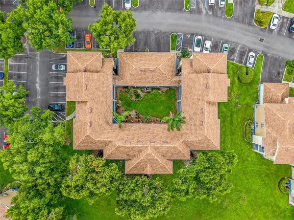 an aerial view of a house with a garden and plants