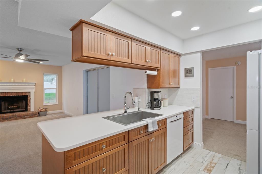 8130 Merrimac Drive Port Richey, FL 34668 - Photo 15 of 53 a kitchen with a sink cabinets and a window
