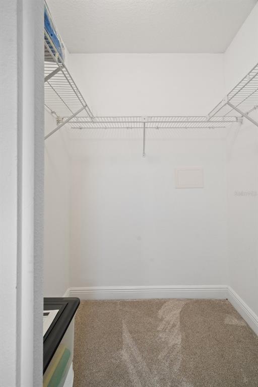 8130 Merrimac Drive Port Richey, FL 34668 - Photo 31 of 53 a view of small space with racks on the wall