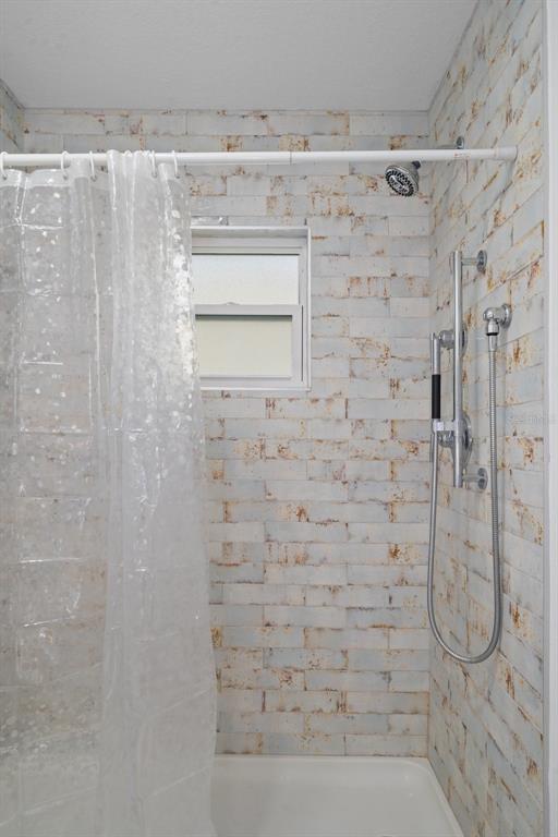 8130 Merrimac Drive Port Richey, FL 34668 - Photo 33 of 53 a bathroom with a shower
