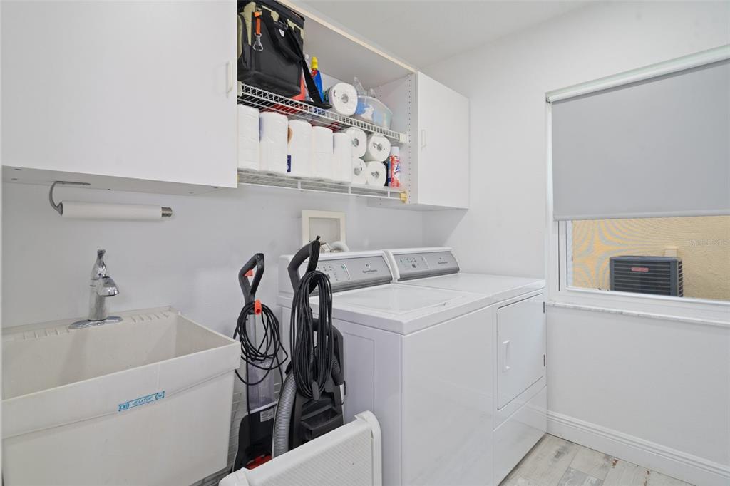 8130 Merrimac Drive Port Richey, FL 34668 - Photo 34 of 53 a utility room with dryer and washer