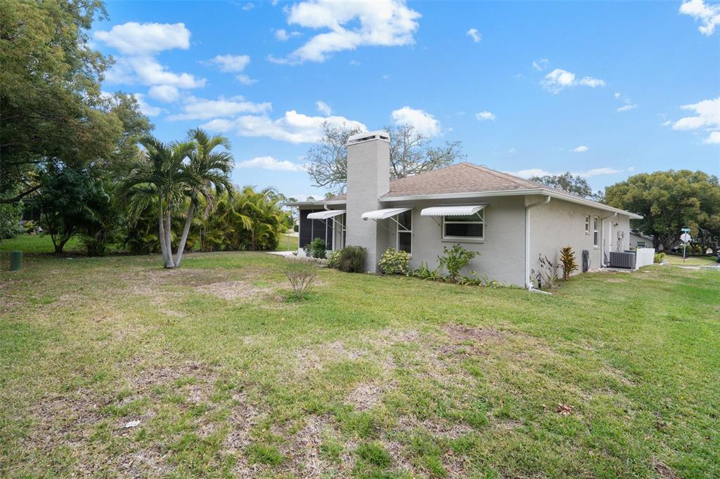 8130 Merrimac Drive Port Richey, FL 34668 - Photo 41 of 53 a view of a house with backyard and garden