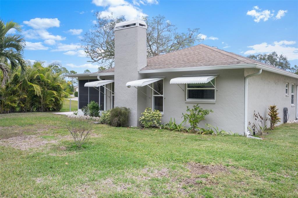 8130 Merrimac Drive Port Richey, FL 34668 - Photo 42 of 53 a front view of a house with garden