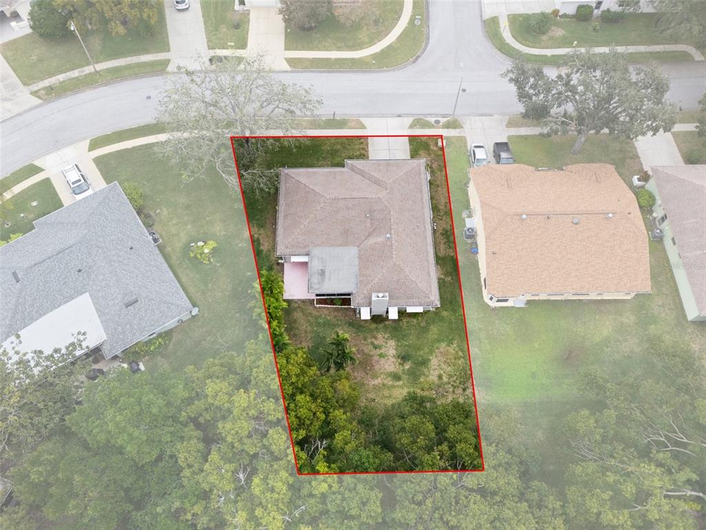 8130 Merrimac Drive Port Richey, FL 34668 - Photo 47 of 53 an aerial view of residential houses with outdoor space