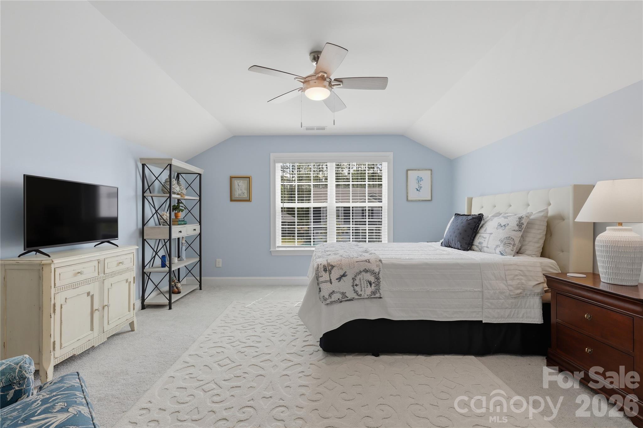 3023 Eagle Ridge Lane Indian Trail, NC 28079 - Photo 37 of 47 a bedroom with a bed and a flat screen tv