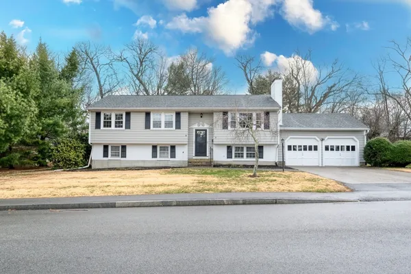 a view of swimming pool with outdoor seating and yard in the back