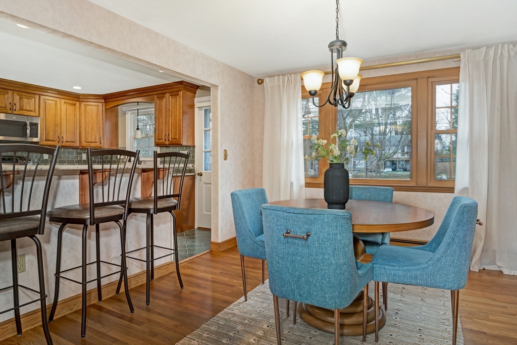 74 Ryder Road Weymouth, MA 02190 - Photo 11 of 33 a dining room with furniture a chandelier and wooden floor