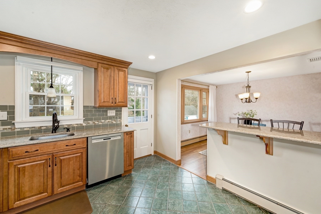 74 Ryder Road Weymouth, MA 02190 - Photo 12 of 33 a large kitchen with a sink and cabinets