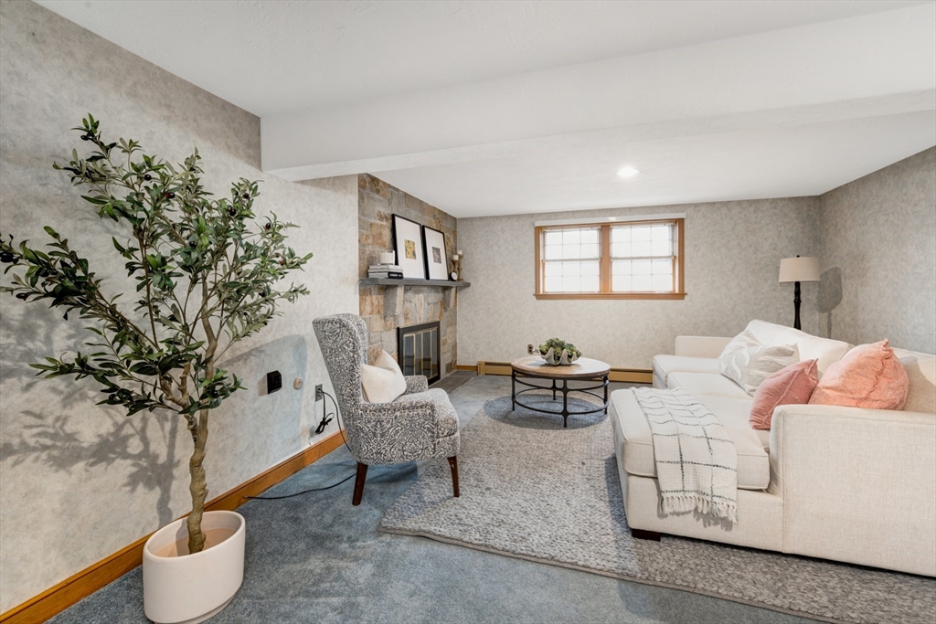 74 Ryder Road Weymouth, MA 02190 - Photo 14 of 33 a living room with furniture and a potted plant