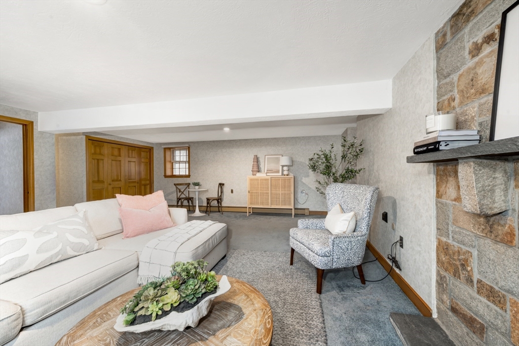 74 Ryder Road Weymouth, MA 02190 - Photo 15 of 33 a living room with furniture and a fireplace