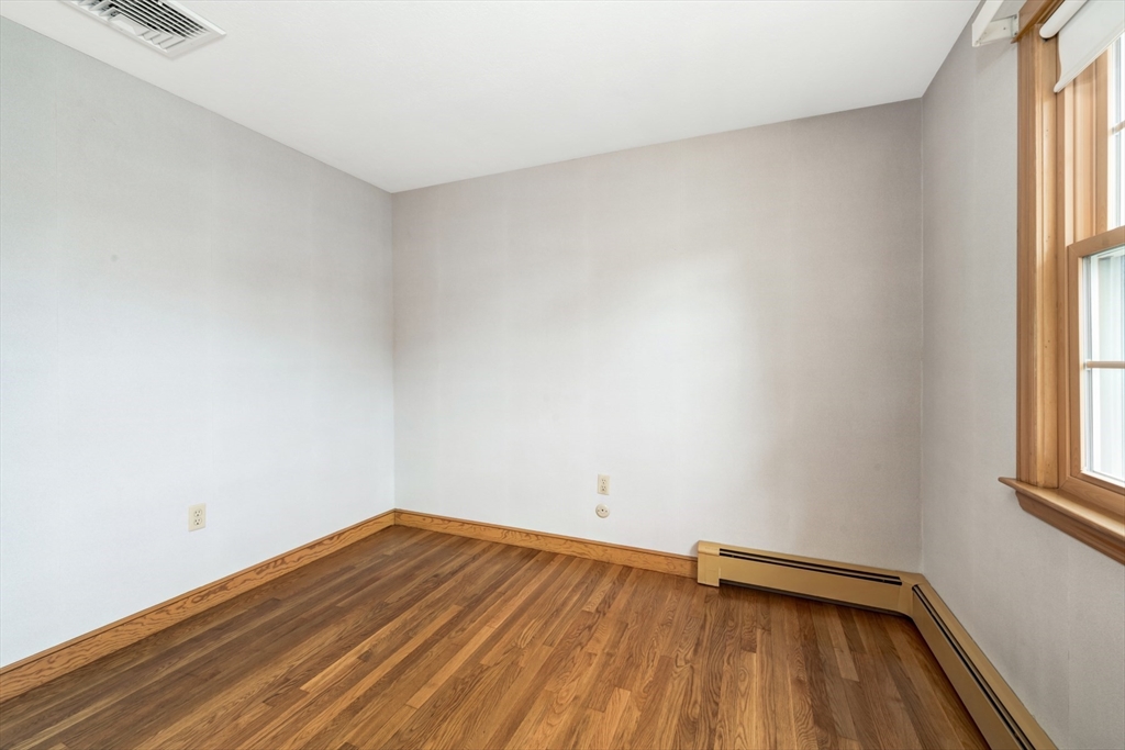 74 Ryder Road Weymouth, MA 02190 - Photo 20 of 33 a view of empty room with wooden floor and fan