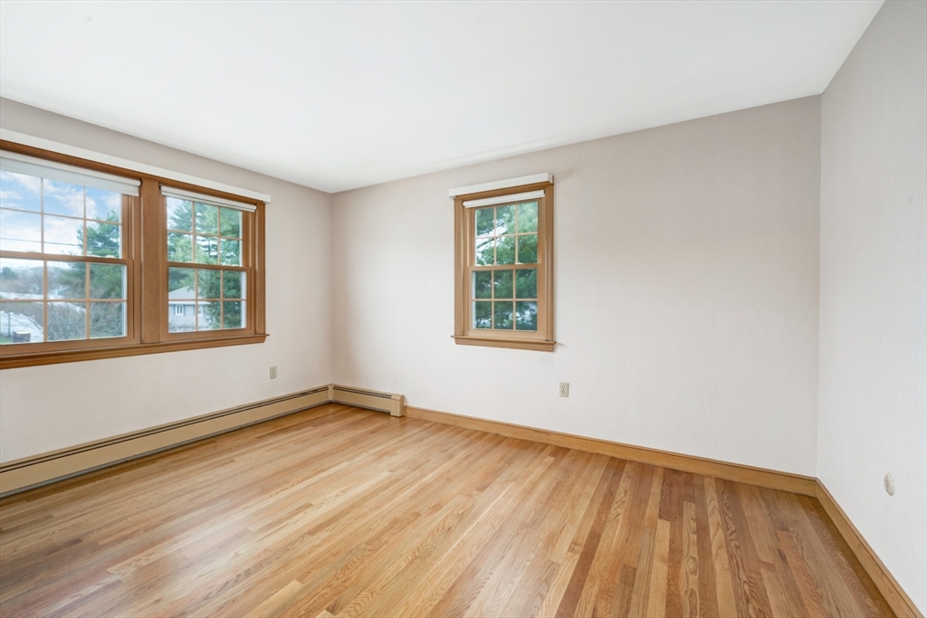 74 Ryder Road Weymouth, MA 02190 - Photo 21 of 33 an empty room with wooden floor and windows