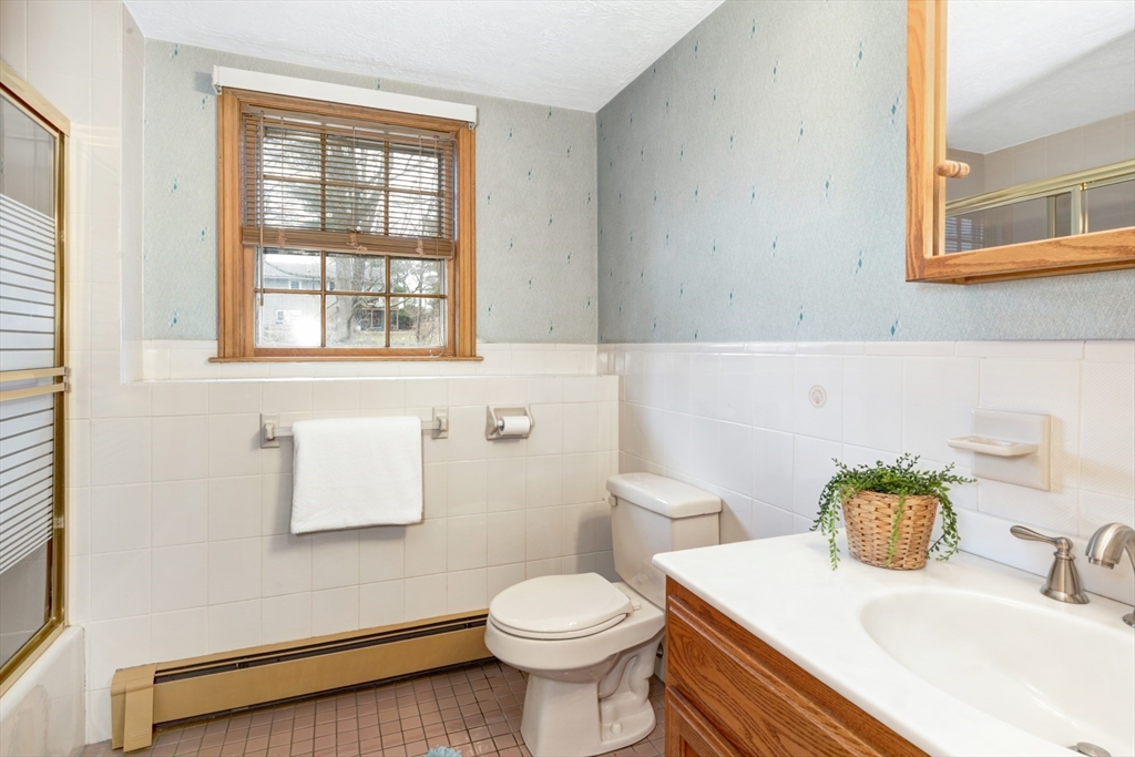 74 Ryder Road Weymouth, MA 02190 - Photo 23 of 33 a bathroom with a sink toilet and a mirror