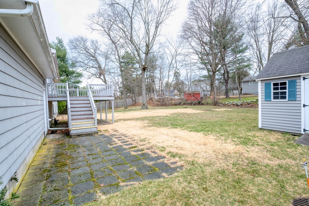 74 Ryder Road Weymouth, MA 02190 - Photo 28 of 33 a view of a yard with a house and a large tree