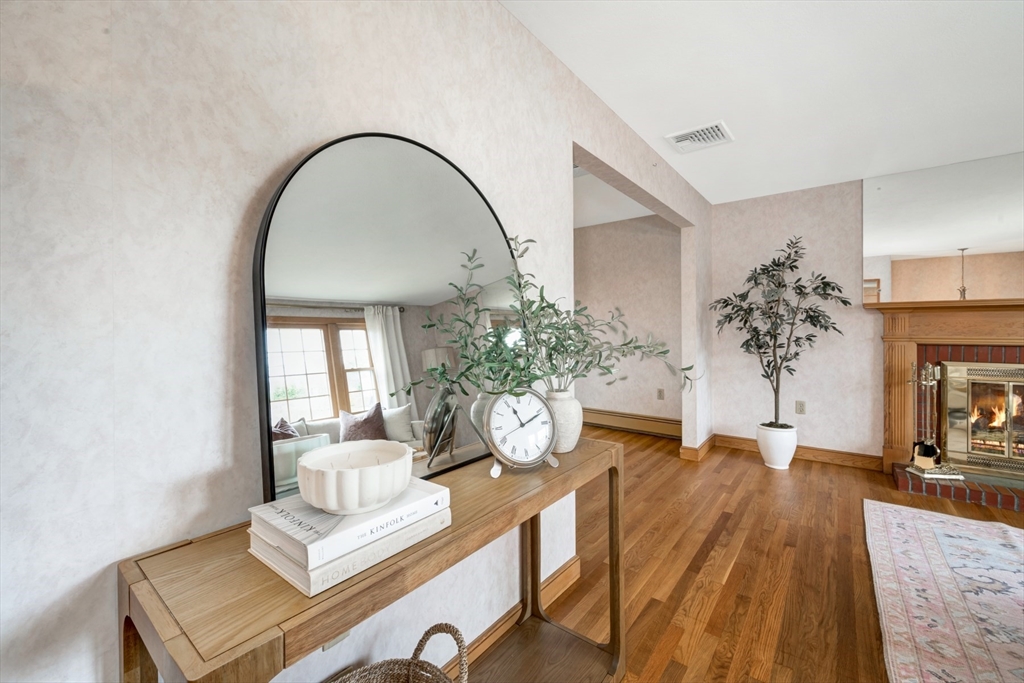 74 Ryder Road Weymouth, MA 02190 - Photo 4 of 33 a living room with furniture and a potted plant
