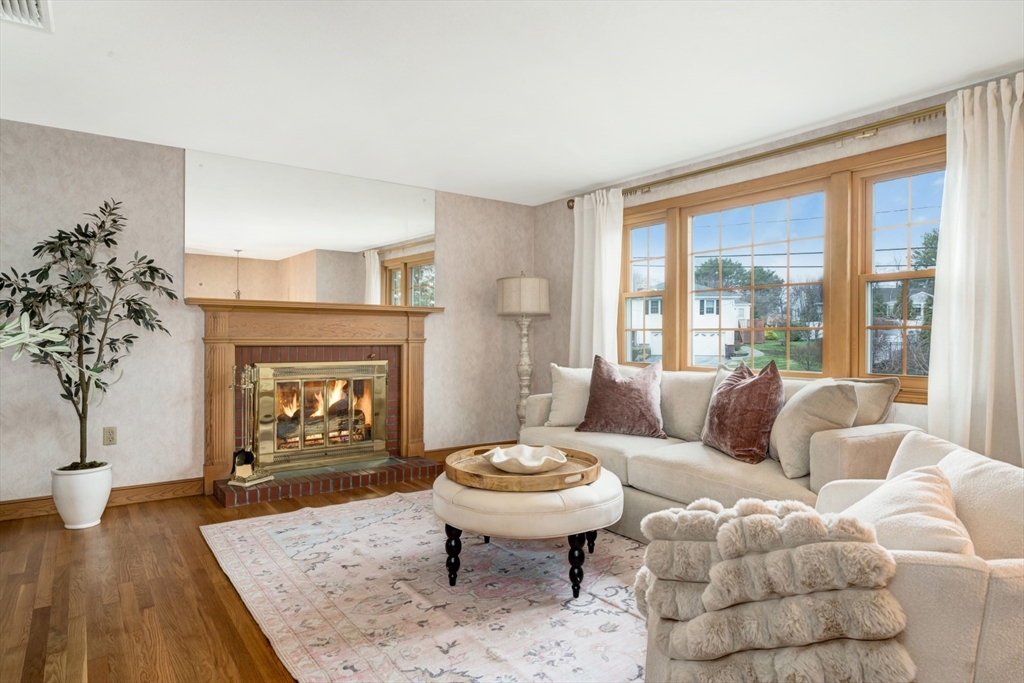 74 Ryder Road Weymouth, MA 02190 - Photo 5 of 33 a living room with furniture a fireplace and a large window