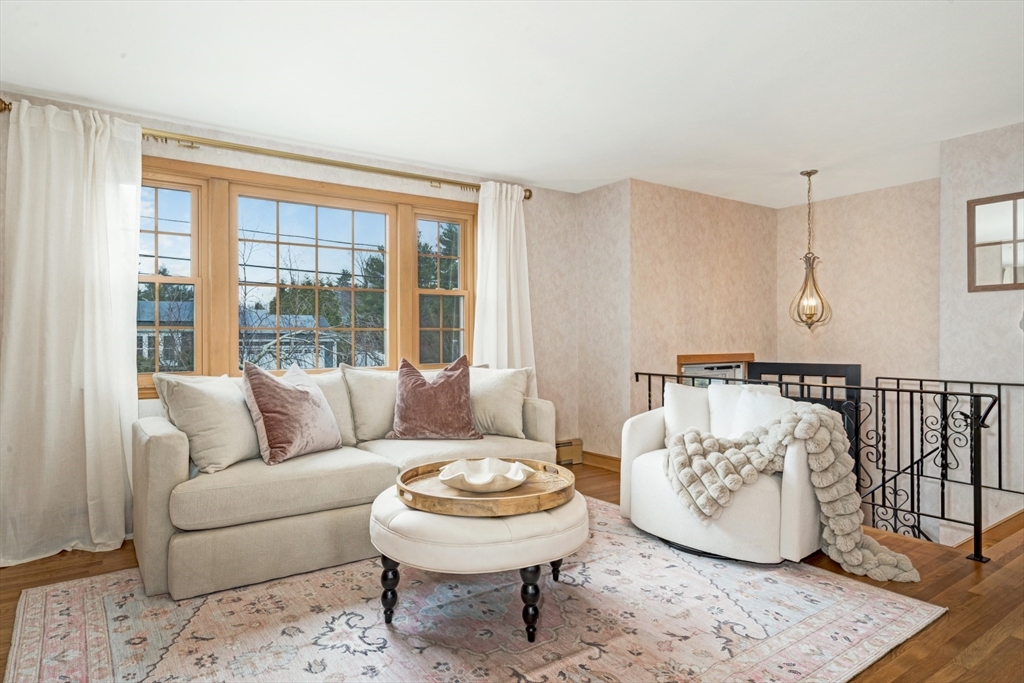 74 Ryder Road Weymouth, MA 02190 - Photo 6 of 33 a living room with a couch and a large window