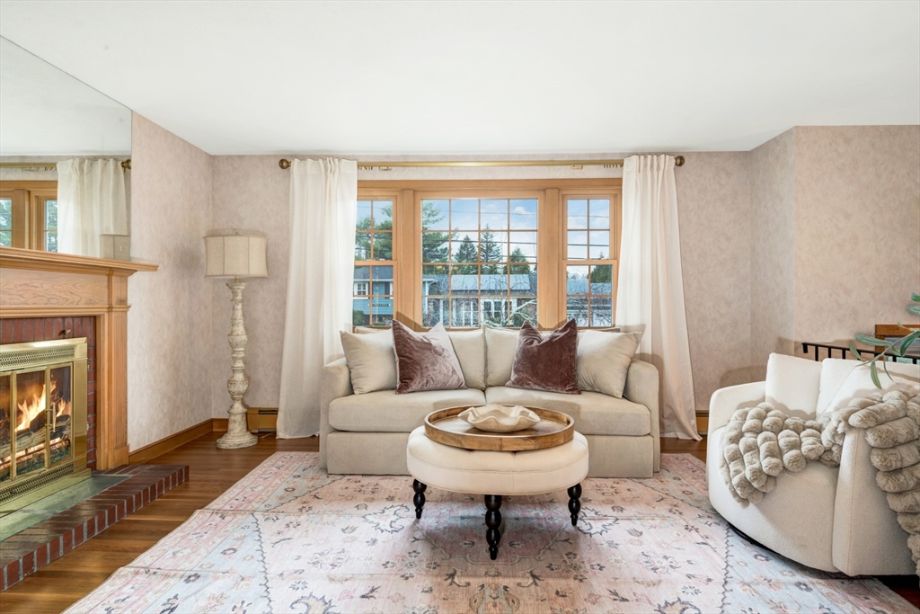 74 Ryder Road Weymouth, MA 02190 - Photo 7 of 33 a living room with furniture and a fireplace