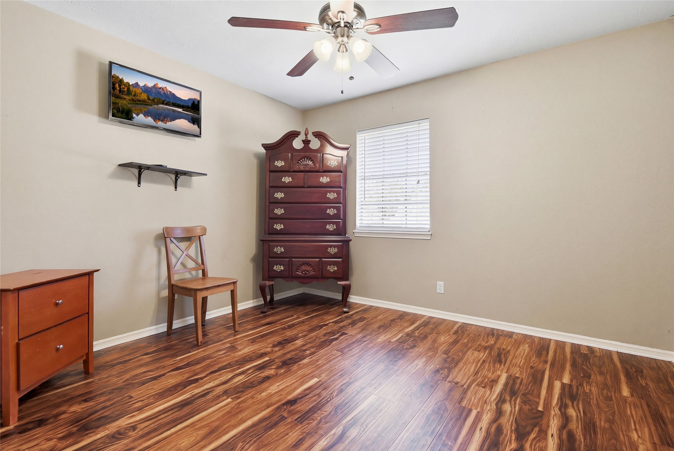 1007 Manatee Lane Houston, TX 77090 - Photo 16 of 25 wooden floor in an empty room with a window