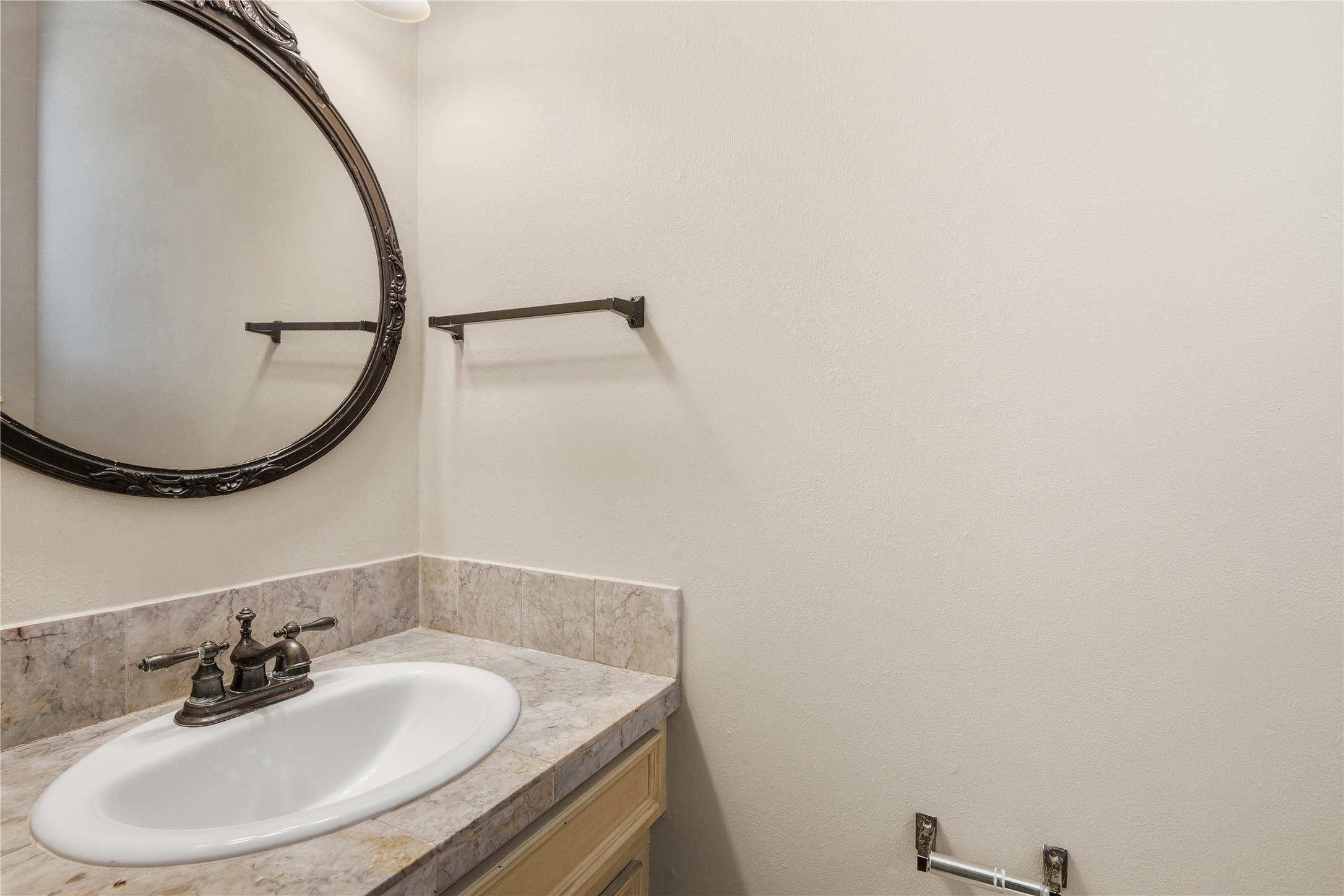 1007 Manatee Lane Houston, TX 77090 - Photo 18 of 25 a bathroom with a sink and a mirror