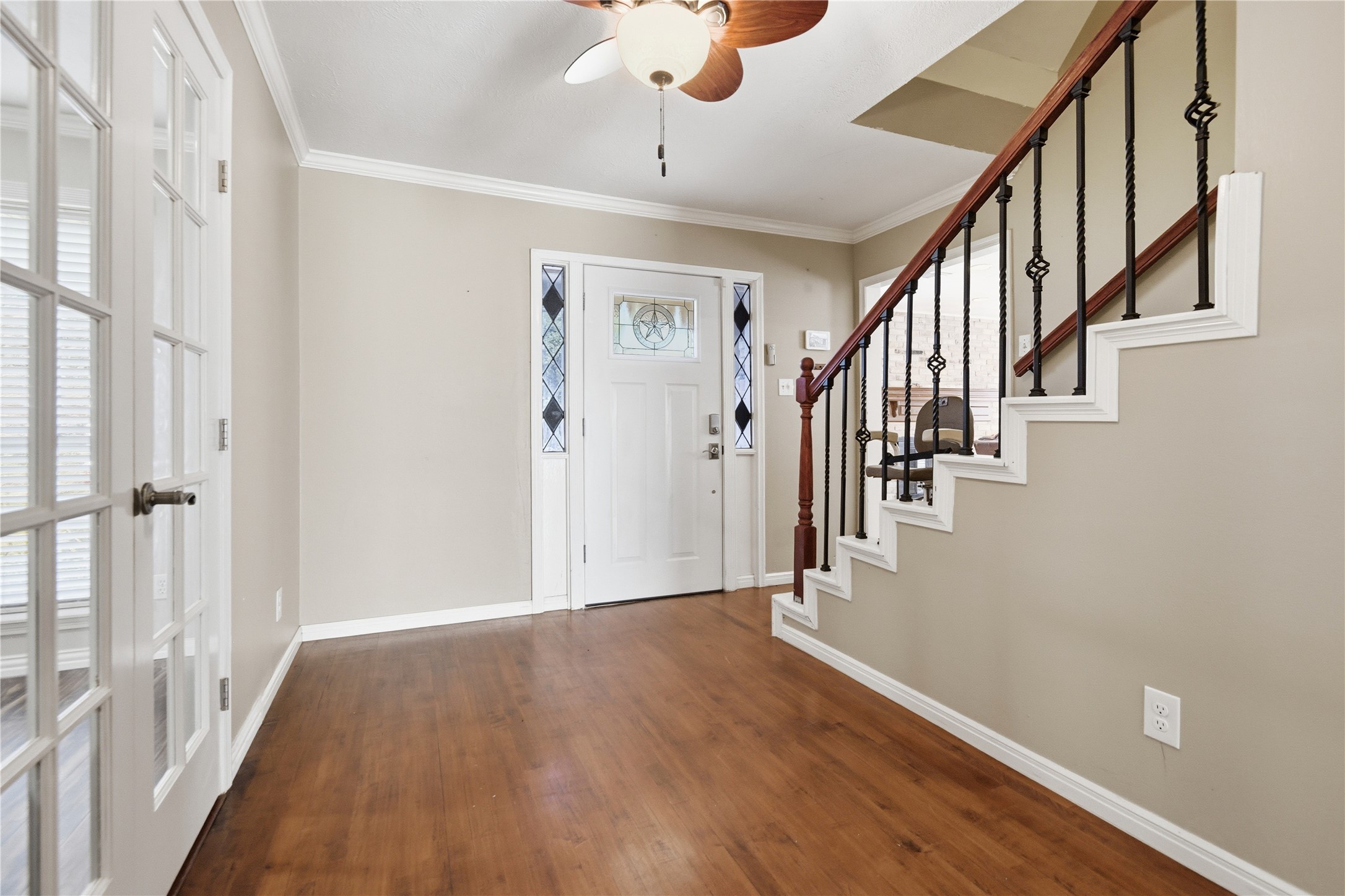 1007 Manatee Lane Houston, TX 77090 - Photo 4 of 25 a view of an entryway with wooden floor