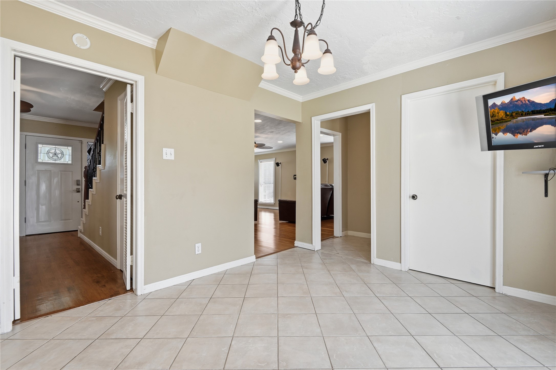 1007 Manatee Lane Houston, TX 77090 - Photo 7 of 25 a view of a hallway with wooden floor and workspace