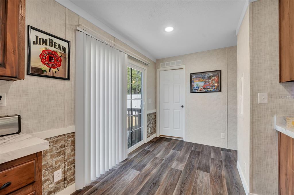 1326 Southwest 69th Road Bushnell, FL 33513 - Photo 14 of 30 a view of a hallway with wooden floor and closet