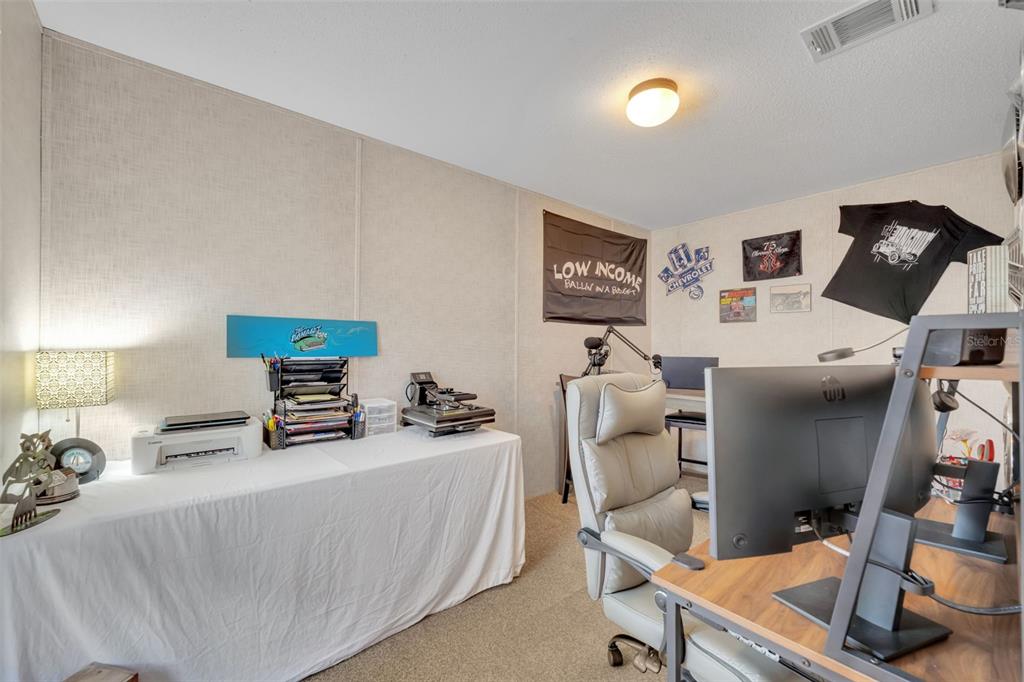1326 Southwest 69th Road Bushnell, FL 33513 - Photo 20 of 30 a living room with furniture and a flat screen tv