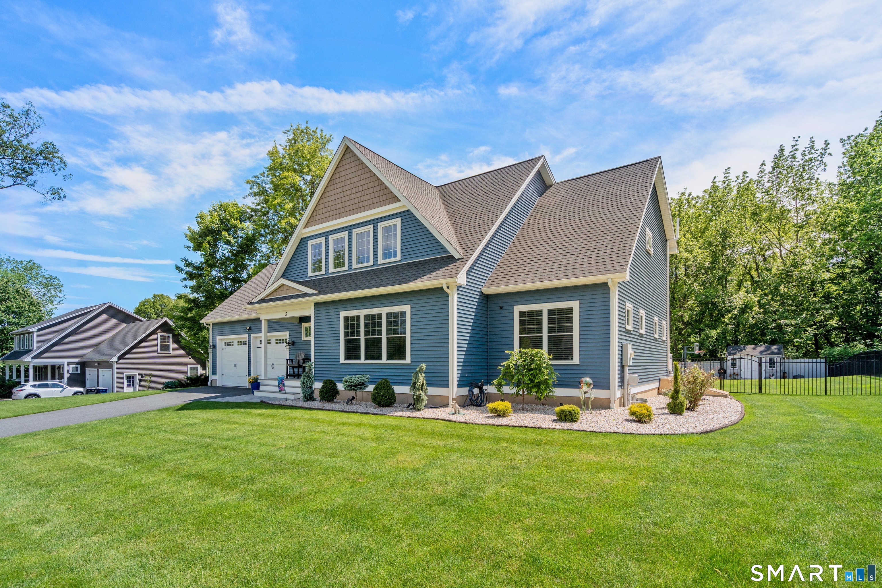 5 Limric Lane Suffield, CT 06078 - Photo 2 of 36 a front view of house with yard and outdoor seating