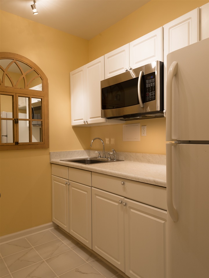 335 Quarry Road, Unit 20 Charlottesville, VA 22902 - Photo 25 of 29 Enjoy this fully equipped brand new kitchenette. Ceramic tile flooring, great storage.